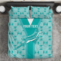 Teal patterned rugby bedding set with white stripe center and two matching pillows