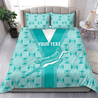Teal patterned bedding set with white V panel, two pillows, and custom text print