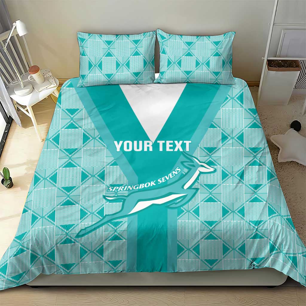 Teal rugby bedding set with white V panel and geometric check pattern; two pillows