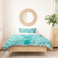 Teal rugby bedding set on a single bed with duvet, two pillows, and geometric pattern