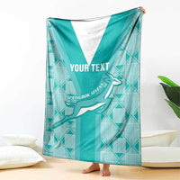 Teal custom rugby blanket with white center V stripe, Springbok graphic, barefoot corner