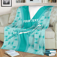 Teal custom rugby blanket on couch with white V stripe, Springbok graphic, "YOUR TEXT"