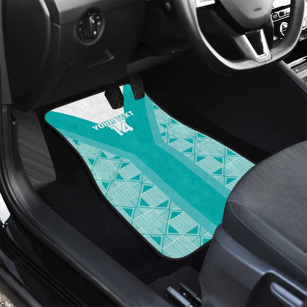 Teal custom-fit car floor mat with geometric pattern and “YOUR TEXT” area