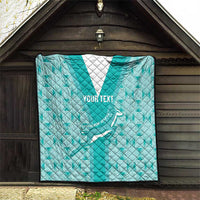 Teal rugby quilt hanging indoors, diamond pattern, “YOUR TEXT,” and rugby player graphic