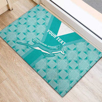Teal rubber rugby doormat angled on floor, diamond pattern, Springbok silhouette, YOUR TEXT