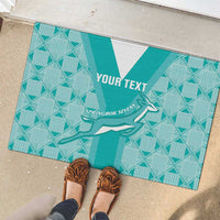 Teal rubber rugby doormat outdoors, diamond pattern with Springbok silhouette and YOUR TEXT