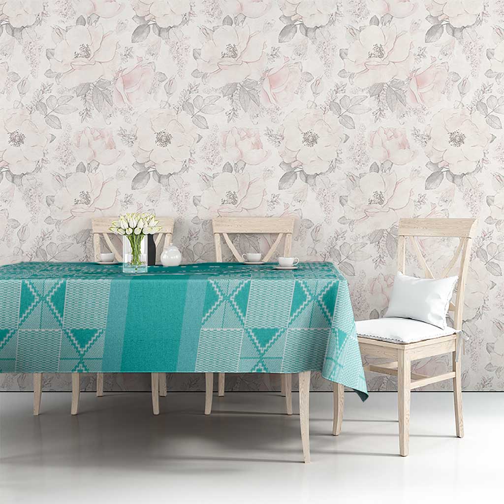 Teal diamond-pattern tablecloth on dining table with chairs in dining room