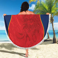 Round red beach blanket with white fringe, blue-and-yellow curved panels, ornate center and 'YOUR TEXT'