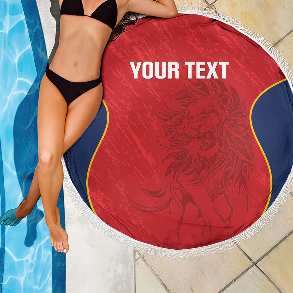 Red round beach blanket with white fringe border, blue-and-yellow curved sides, 'YOUR TEXT'