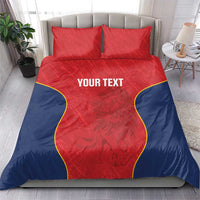 Red and navy duvet cover with two pillows; yellow trim around a central panel reading “YOUR TEXT”