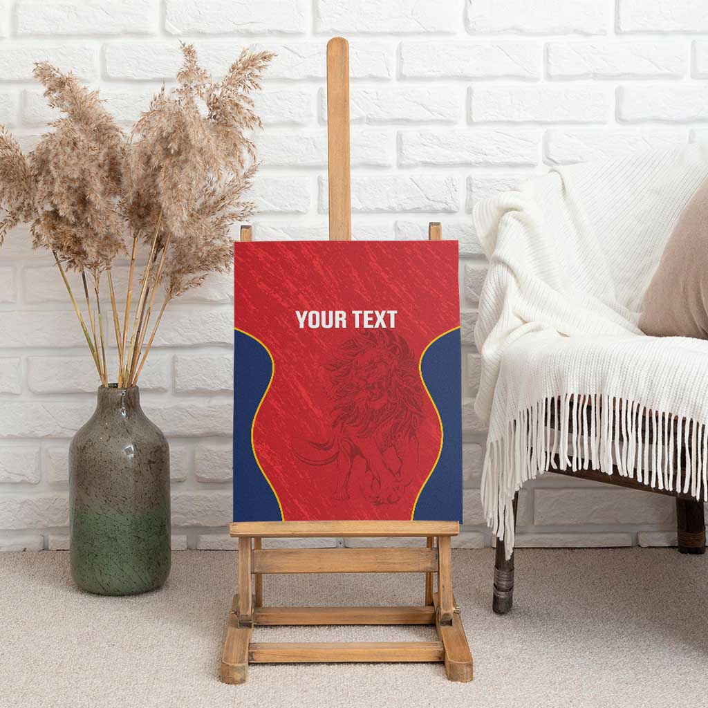 Red canvas wall art on an easel with blue/yellow border, lion emblem and “YOUR TEXT”