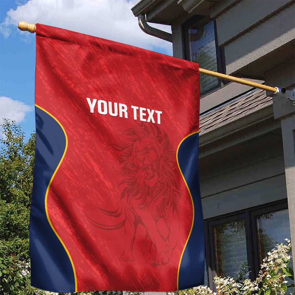 Custom red rugby garden flag on wooden pole, blue wavy trim, 'YOUR TEXT' and lion art