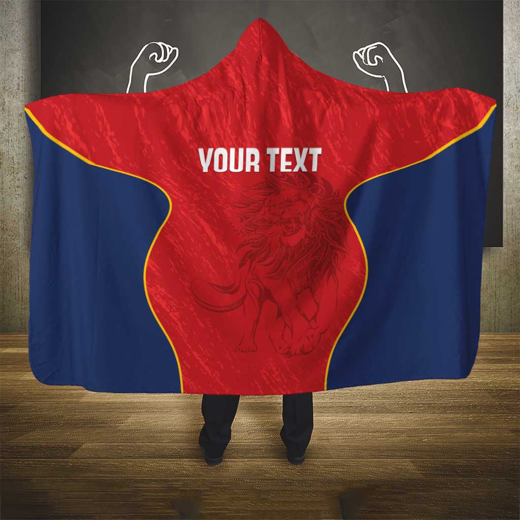 Red and navy hooded rugby-style blanket with lion graphic and custom text, split border