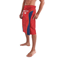 Men's red rugby-style shorts with blue stripe and printed front, angled side view