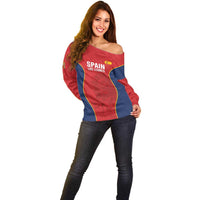 Women’s red off-shoulder sweater front view, navy and yellow side panels and crest