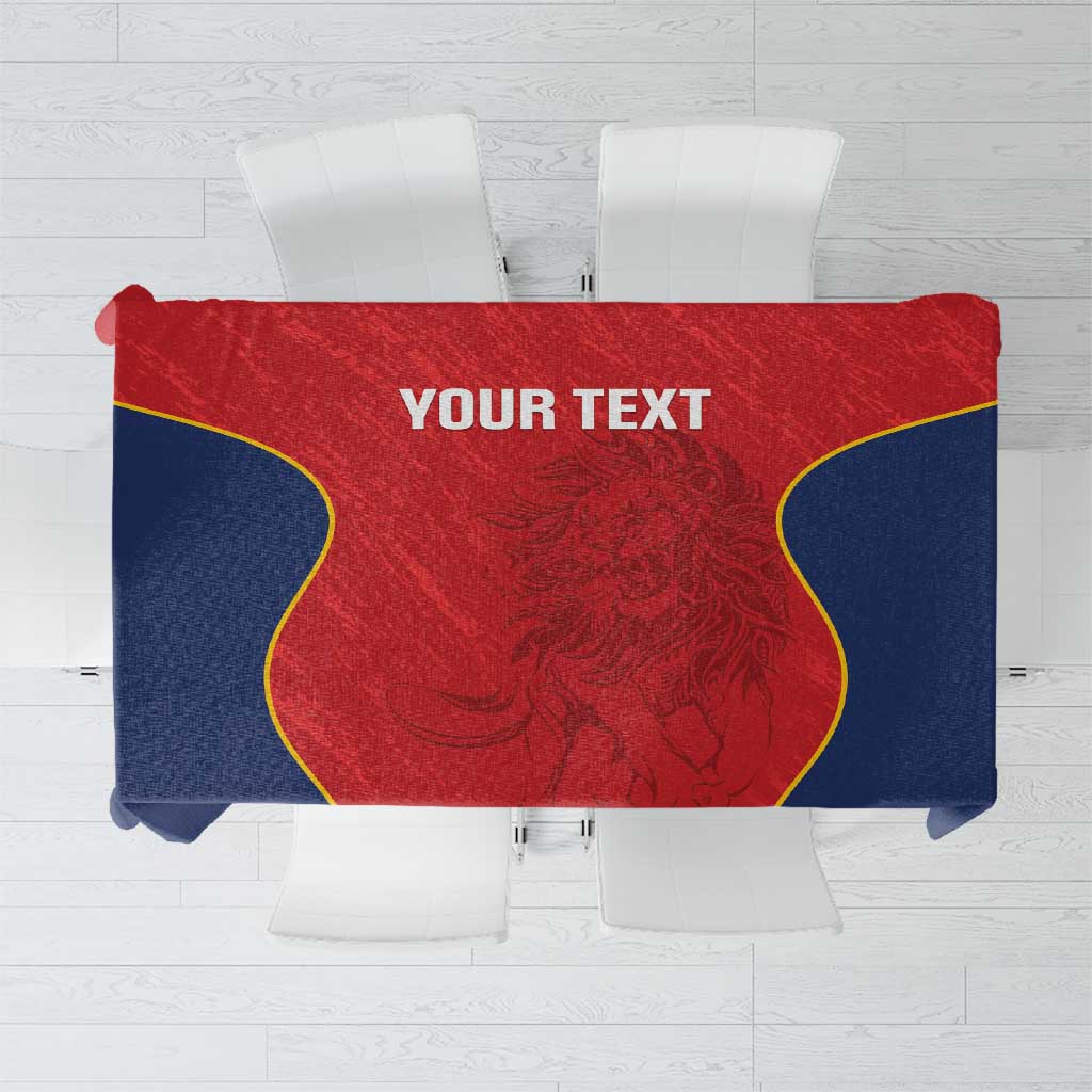 Custom tablecloth with red center panel, navy sides, and yellow edge trim