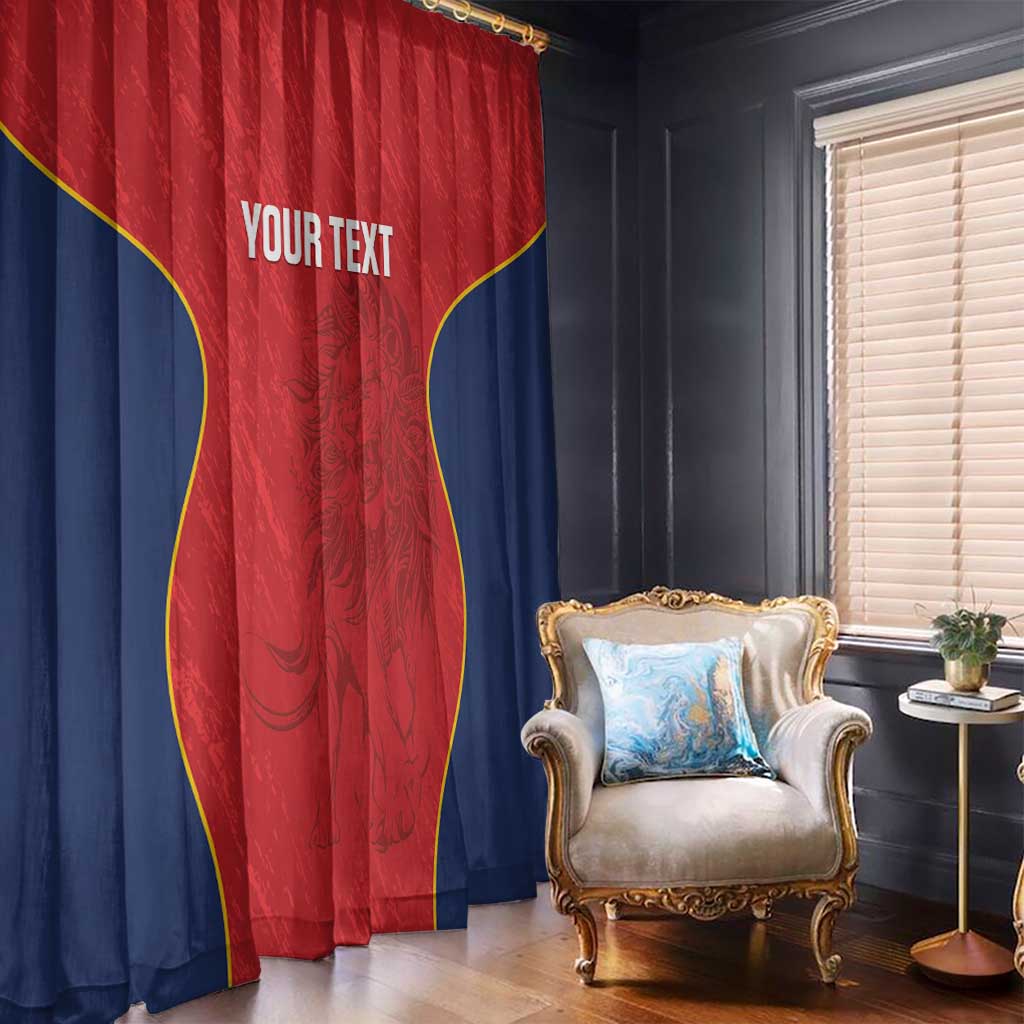 Red and navy window curtains with yellow curved trim and custom text, hanging over a window