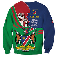 Back of color-block sweatshirt with Namibia slogan and coat of arms graphic, blue red green