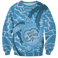 Blue crewneck sweatshirt with ocean turtle graphic and full-color map print