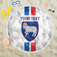 Round beach blanket with fringe edge, Faroe crest shield and custom text
