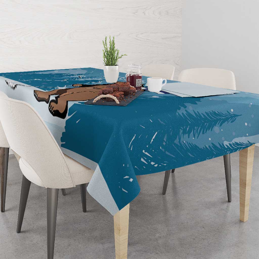 Blue printed tablecloth with bear face, Finland map shape, and pine tree details