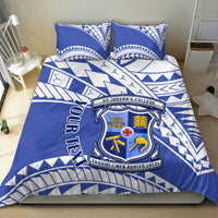 Blue and white duvet cover with school crest, geometric trim, and two matching pillowcases