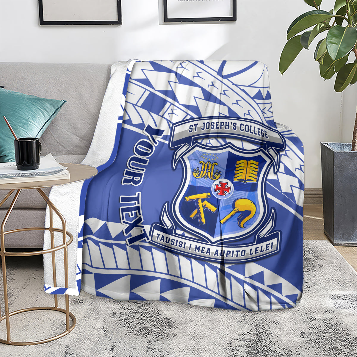 Blue and white St Joseph's College crest blanket laid over a chair
