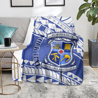 Blue and white St Joseph's College crest blanket laid over a chair