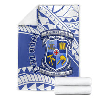 Blue and white St Joseph's College crest blanket with geometric pattern, folded with rolled towels