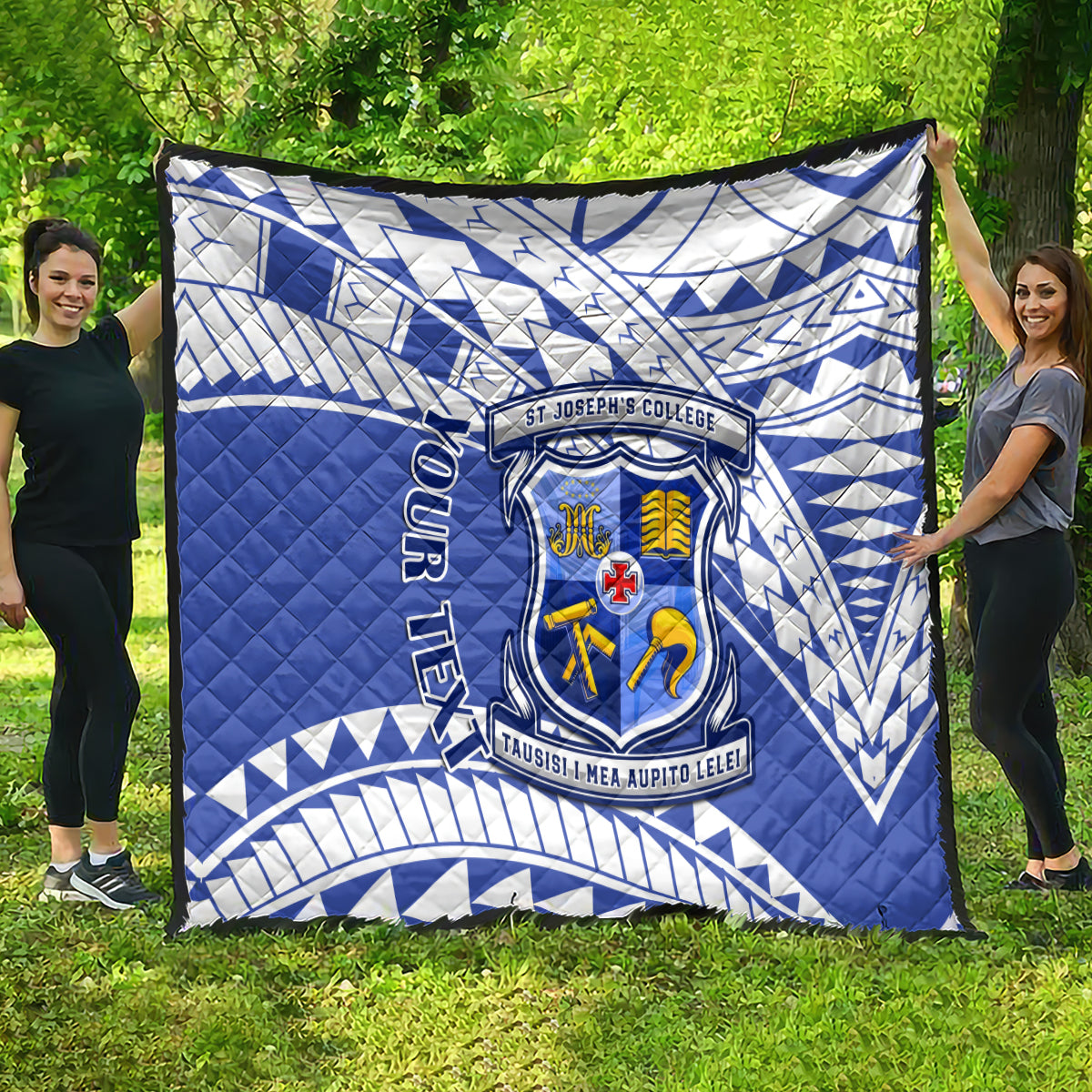 Blue and white St Joseph’s College quilt with geometric design and crest