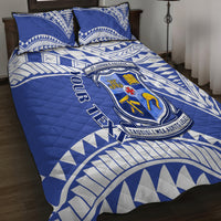 Blue quilt bed set with geometric tribal pattern and school crest artwork across cover