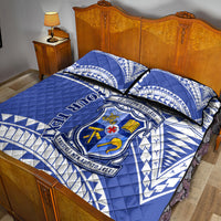 Blue and white quilt bed set with crest emblem and quilted diamond texture panels