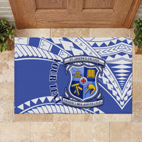 Blue rubber doormat laid flat with school crest, “YOUR TEXT,” and white geometric borders.