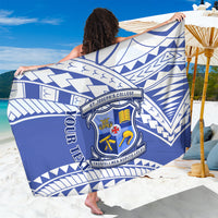 Blue college sarong with white Samoan geometric pattern and crest logo