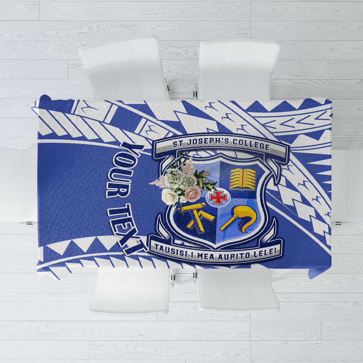 Blue tablecloth with geometric pattern and school crest centerpiece