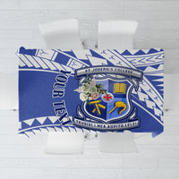Blue tablecloth with geometric pattern and school crest centerpiece