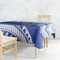 Blue tablecloth with geometric print draped over rectangular table