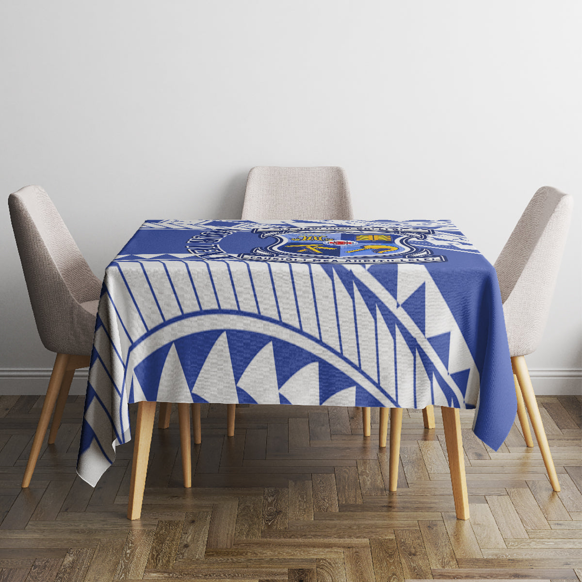 Blue geometric tablecloth with crest panel on small square table