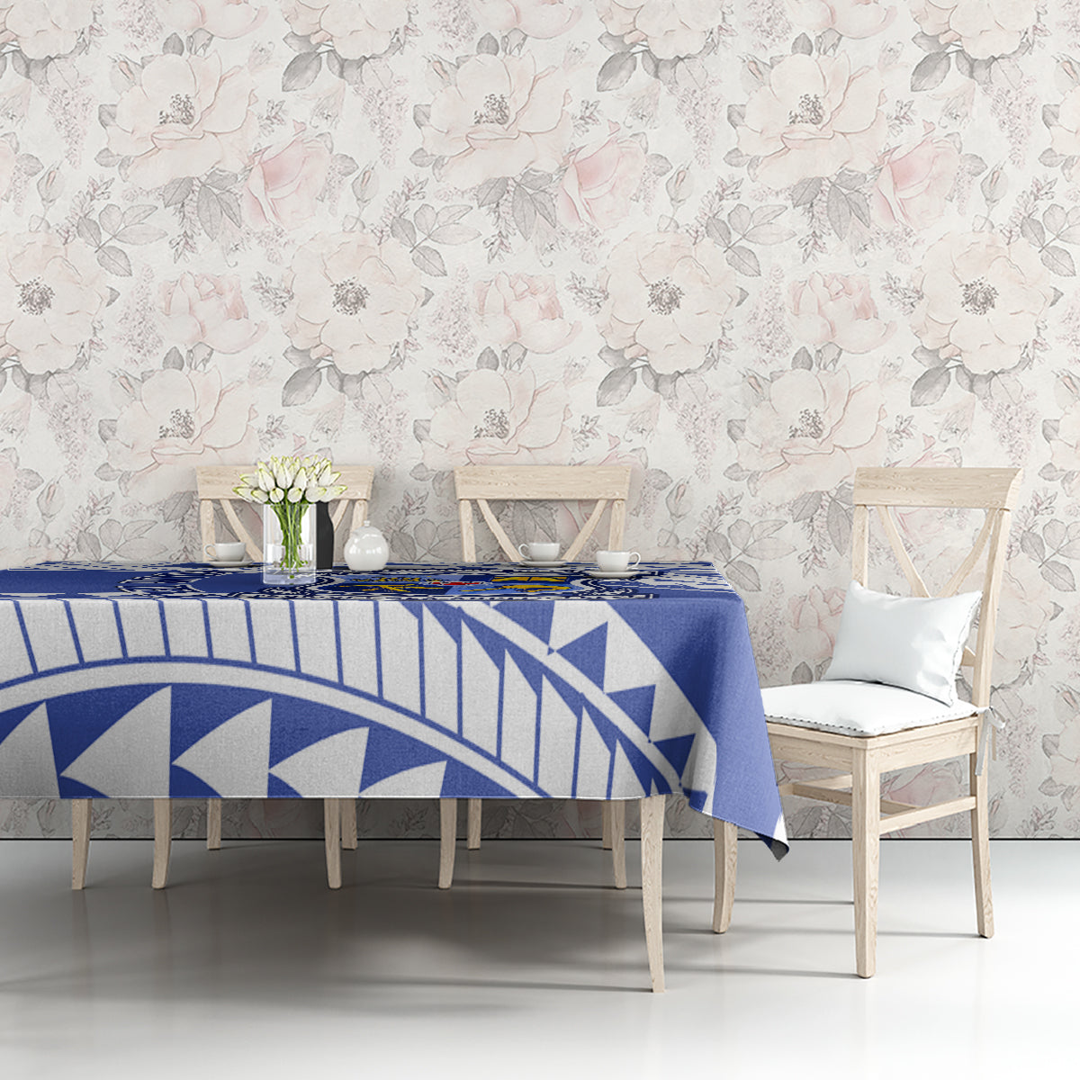 Blue and white geometric tablecloth on dining table with chairs