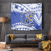 Blue and white patterned tapestry with school crest emblem at center