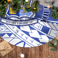 Blue and white patterned tree skirt with crest emblem and geometric shapes, circular