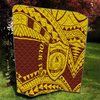 Gold and maroon quilt blanket featuring geometric lines, central shield crest, and ORRITUA