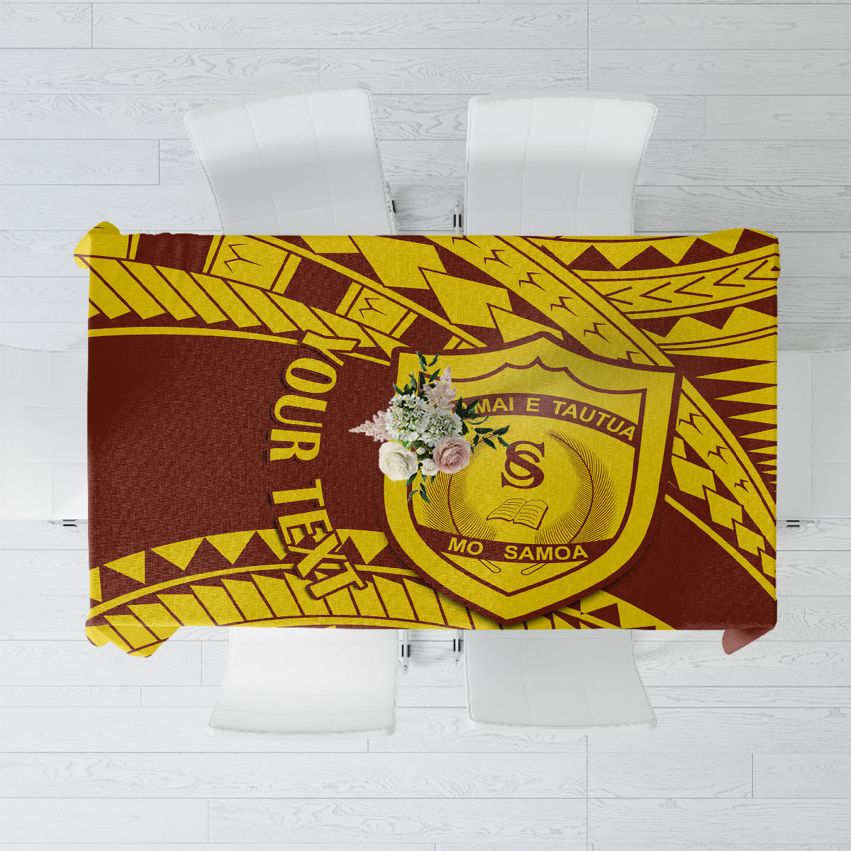 Gold and dark brown Samoan-style patterned tablecloth with crest motif