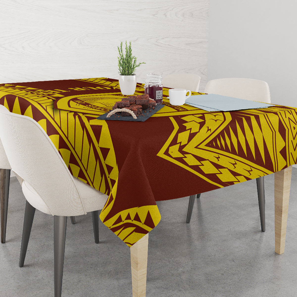 Gold and maroon Samoan-style crest tablecloth with triangular geometric pattern