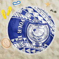 Blue round beach blanket with white fringe edge and circular college crest in geometric print