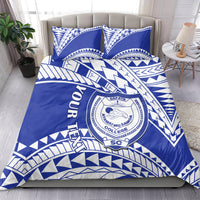 Blue and white bedding set with matching pillow featuring SAFATA College crest