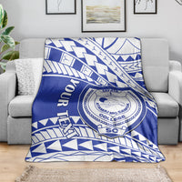 Blue and white geometric college blanket featuring a circular crest emblem