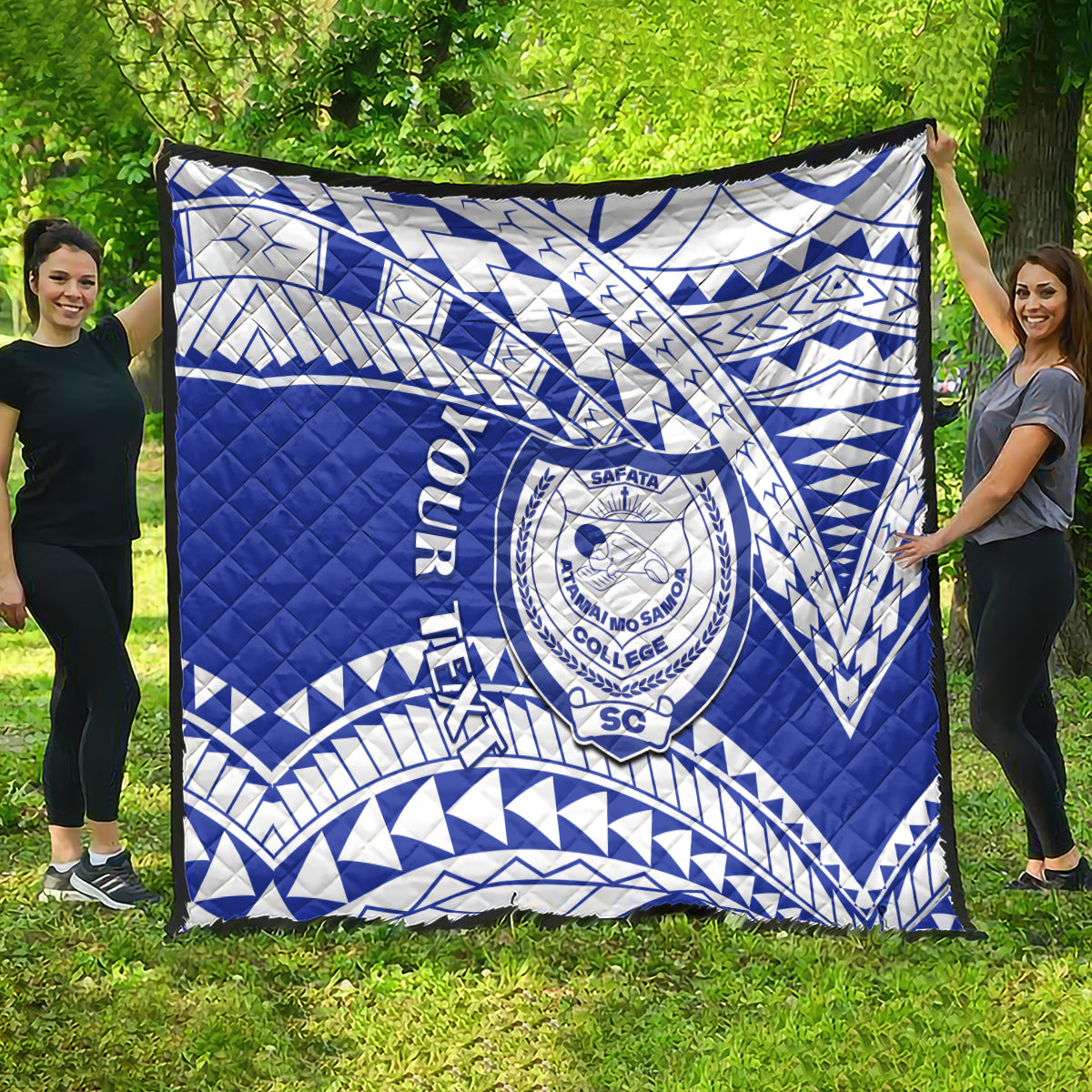Blue and white Samoan pattern college quilt spread out, showing large crest emblem