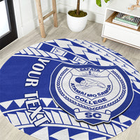 Blue and white round patterned carpet with large college crest emblem in center