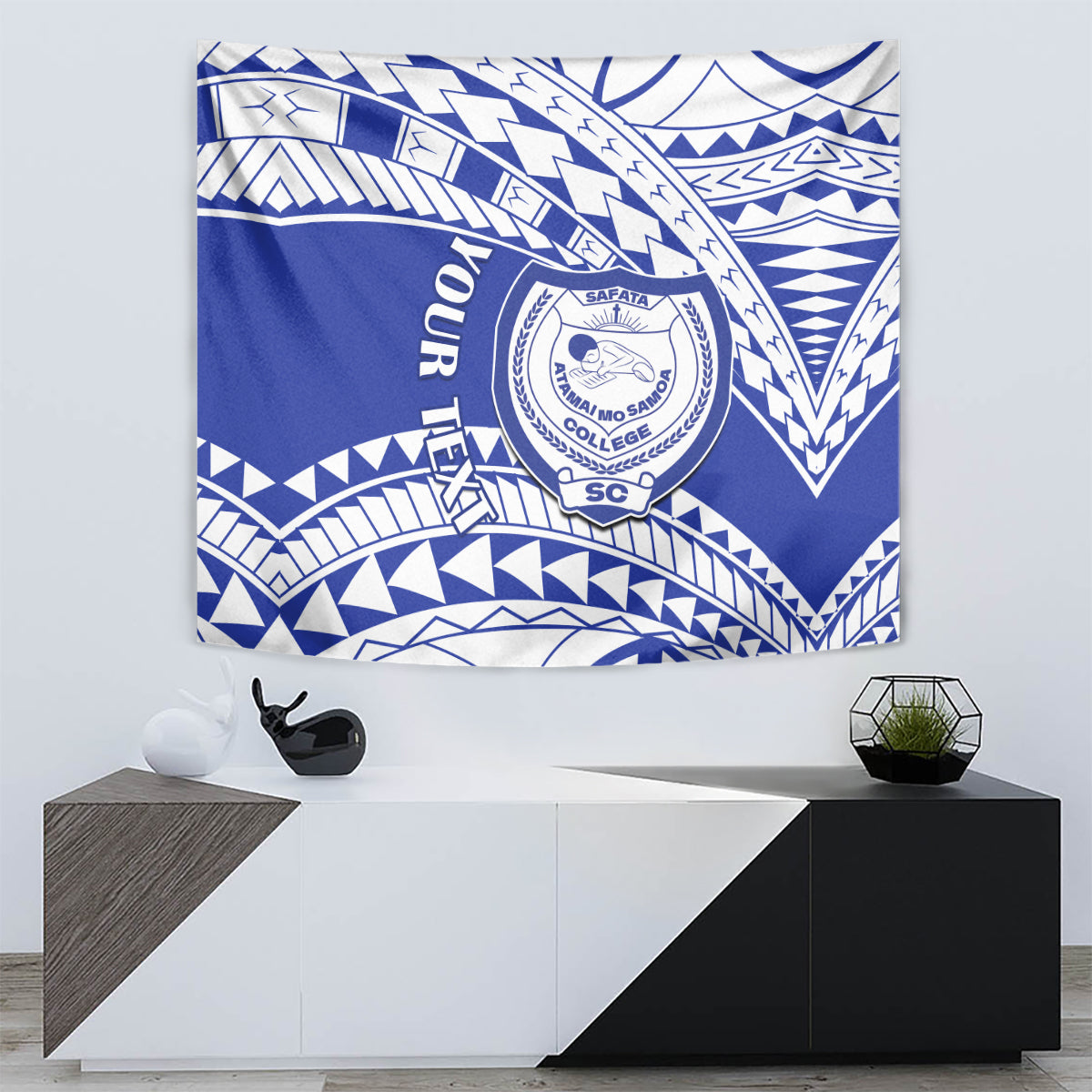Blue and white Samoan-pattern tapestry with a central circular school emblem and swirls
